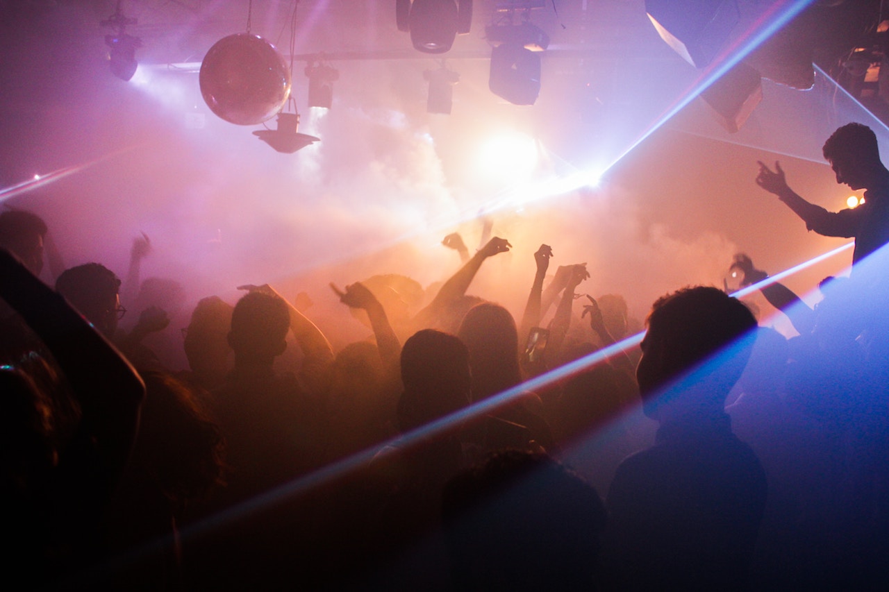 people dancing inside of club