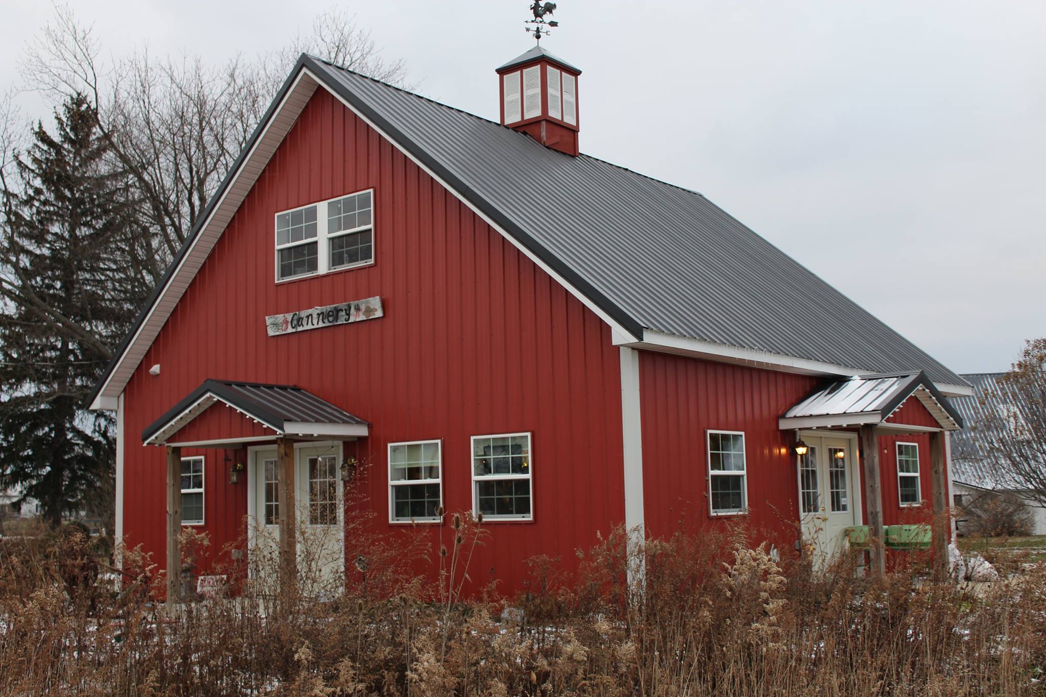 Glass Rooster Cannery, red building with blue roof
