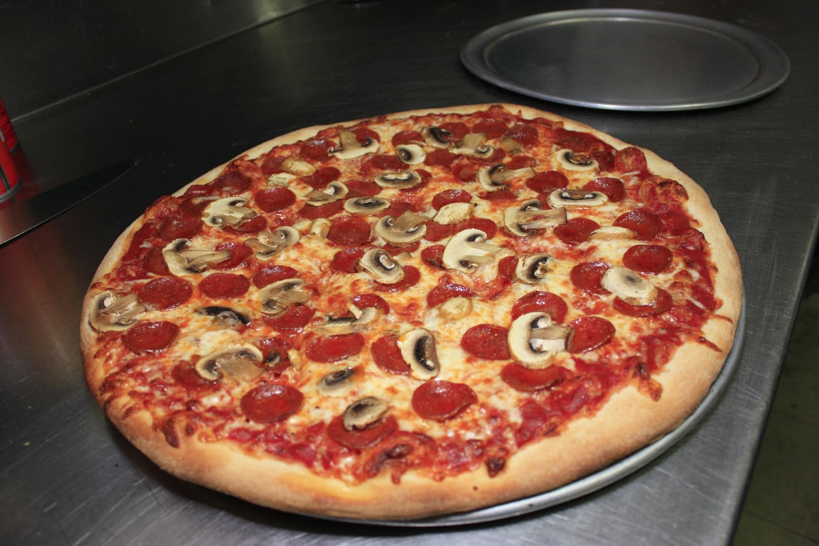 Musroom and pepperoni pizza on in the kitchen