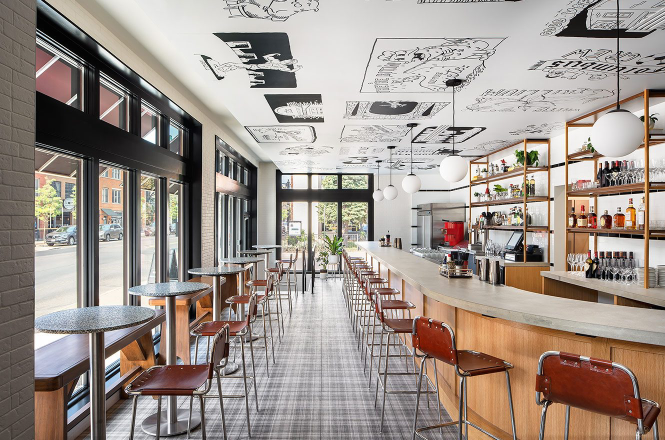 Bright and airy bar area with midcentury style