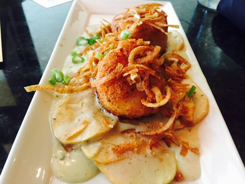 Extravagant dish at Lemongrass Fusion with crispy onions and breaded fish