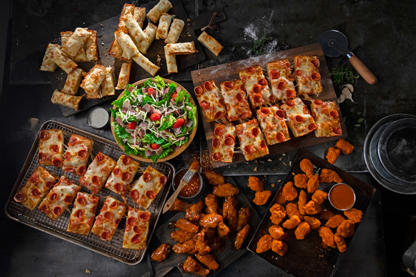 Photo of pizza, wings, and salad from Jet's Pizza