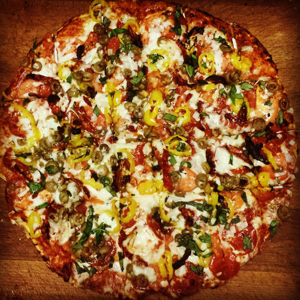 Thin crust pizza loaded with cheese and veggies