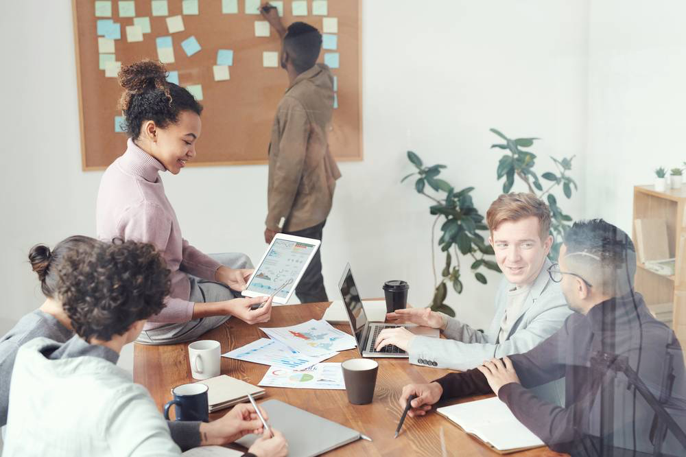 young professionals in office setting working together