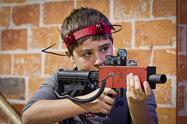 little kid playing laser tag