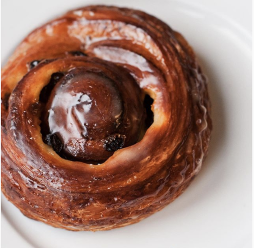 Cinnamon Roll on a White Plate