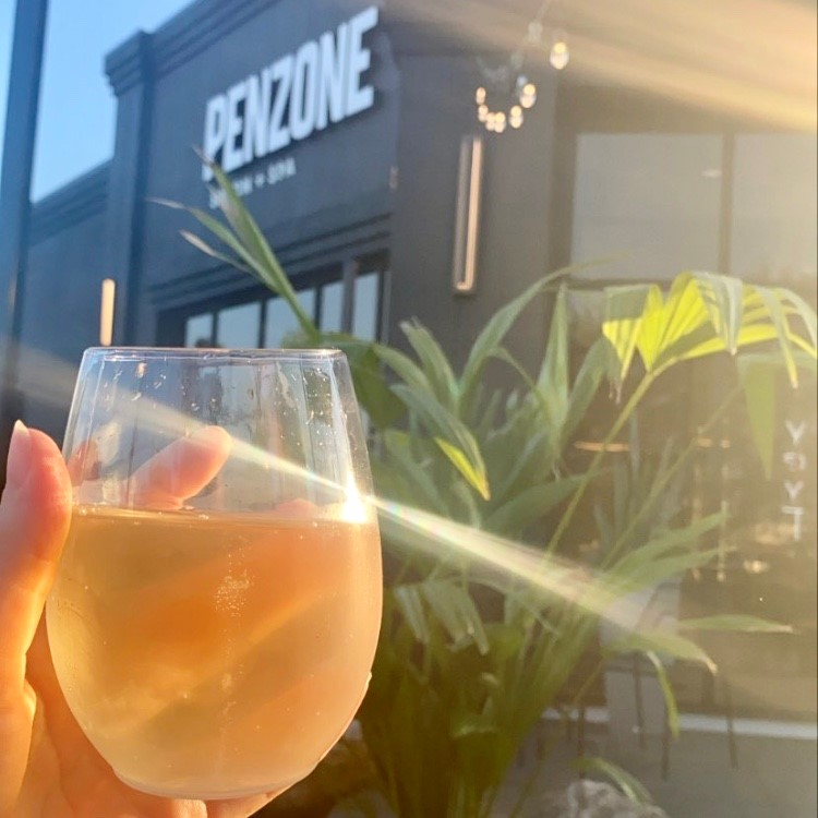 Glass of Wine outside of Penzone Hair Salon