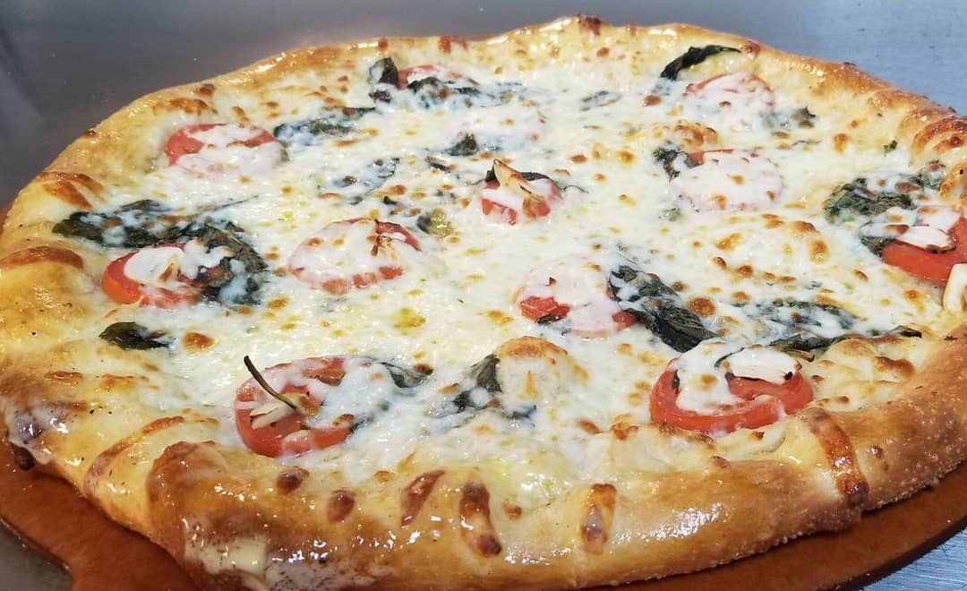 margarita pizza from Halwani Cuisine