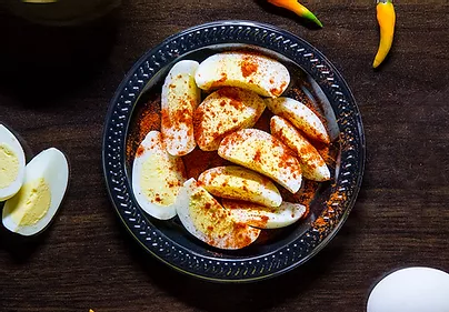 Slice Hardboiled Eggs Covered in Cayenne pepper