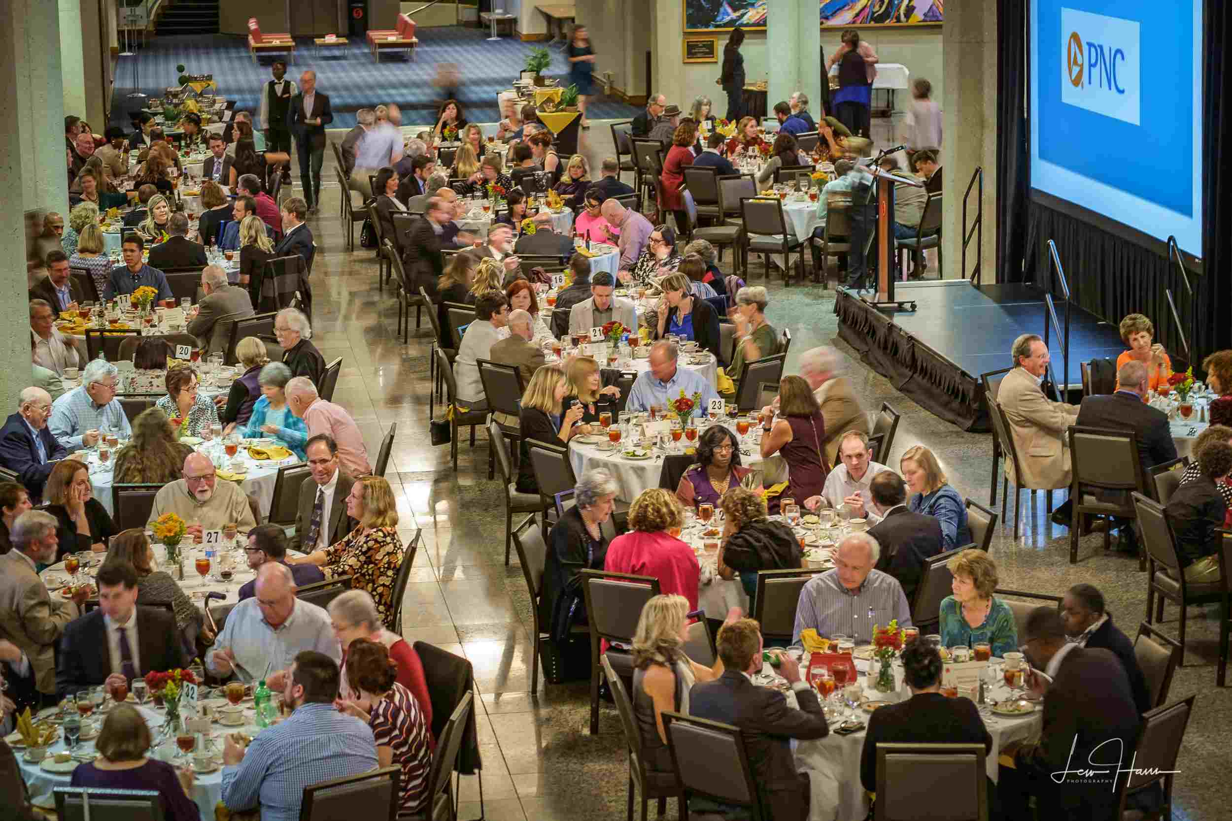 A hall of seniors gathering to eat