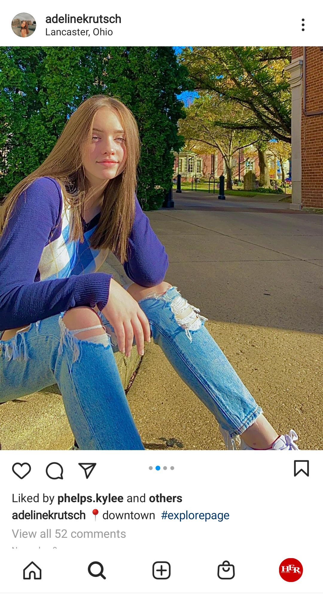 Young girl sit on sidewalk
