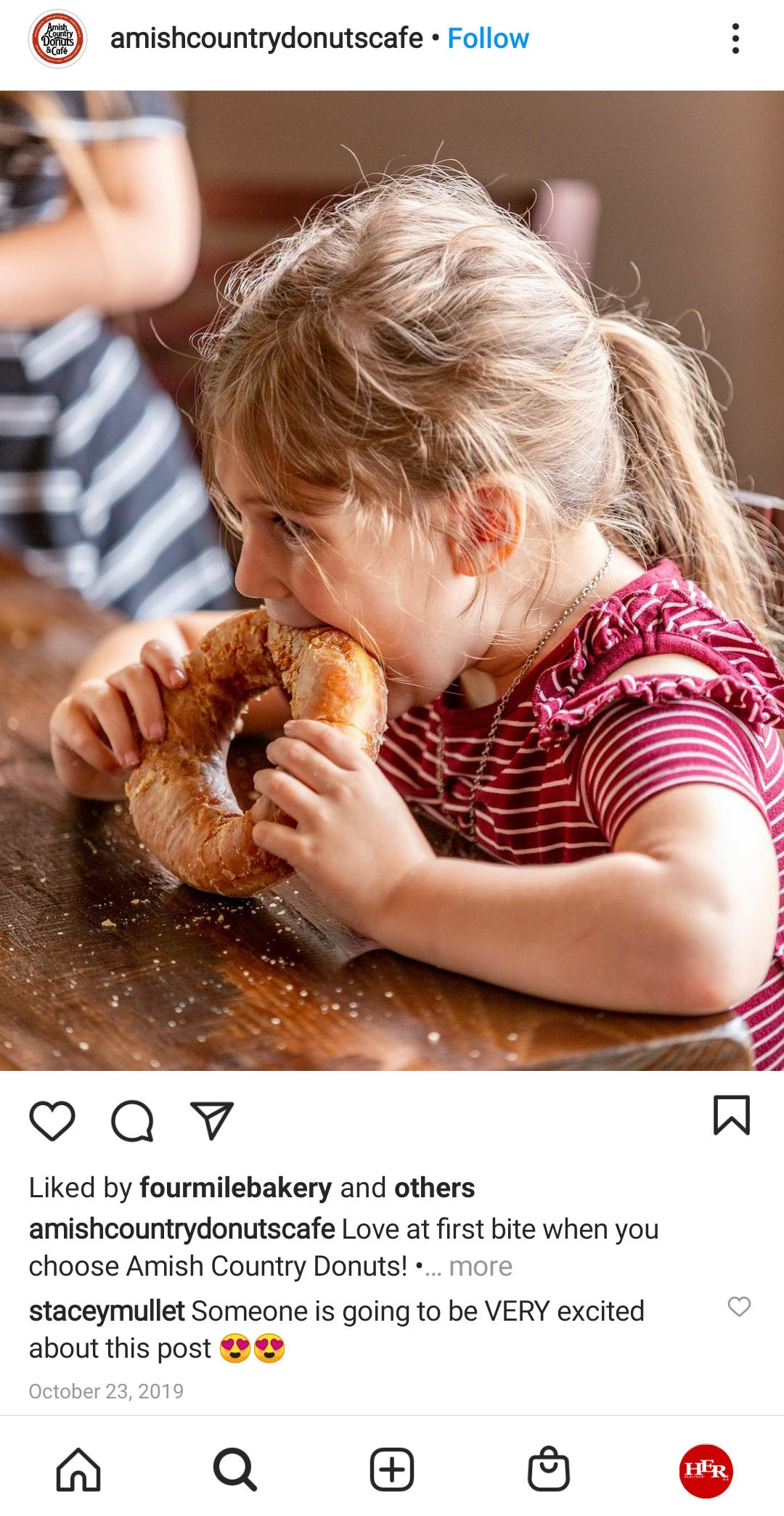 Young girl eating donut