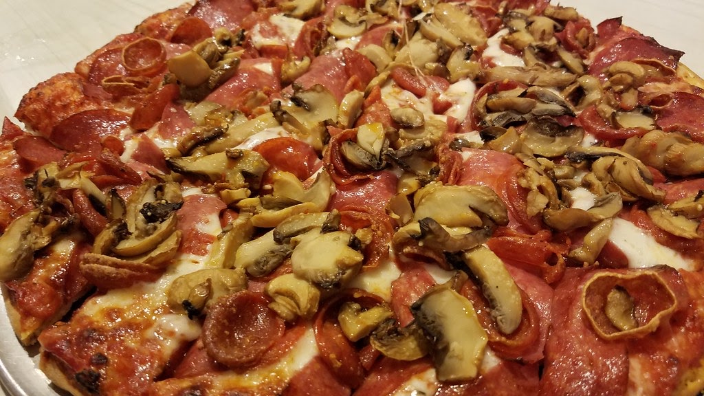 A pepperoni and mushroom pizza.