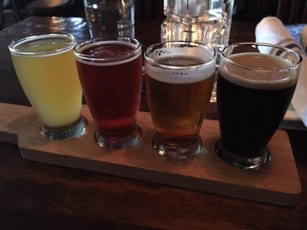 An image depicting Arch City Tavern's beer flights that give you a sample of four different beers!
