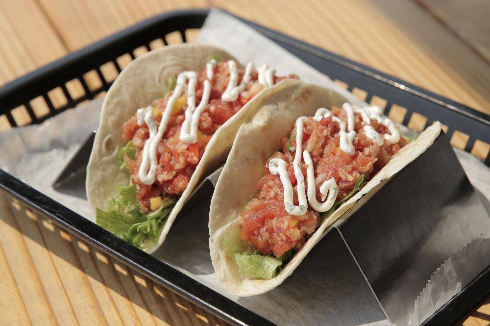 two wraps with chicken, lettuce, and special sauce
