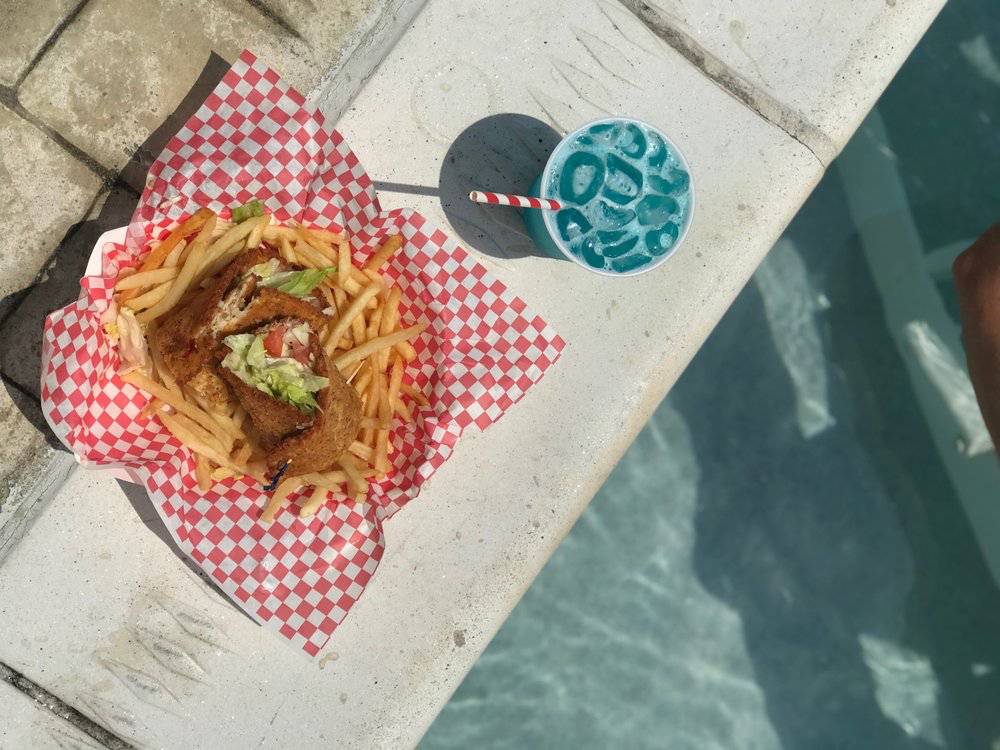 delicious wrap and signature cocktail by the pool
