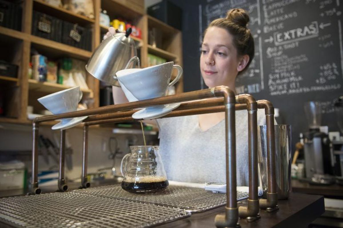 A barista crafting a coffee drink in Cincinnati Ohio