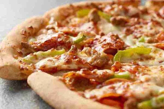Crispy pizza topped with sausage and peppers.