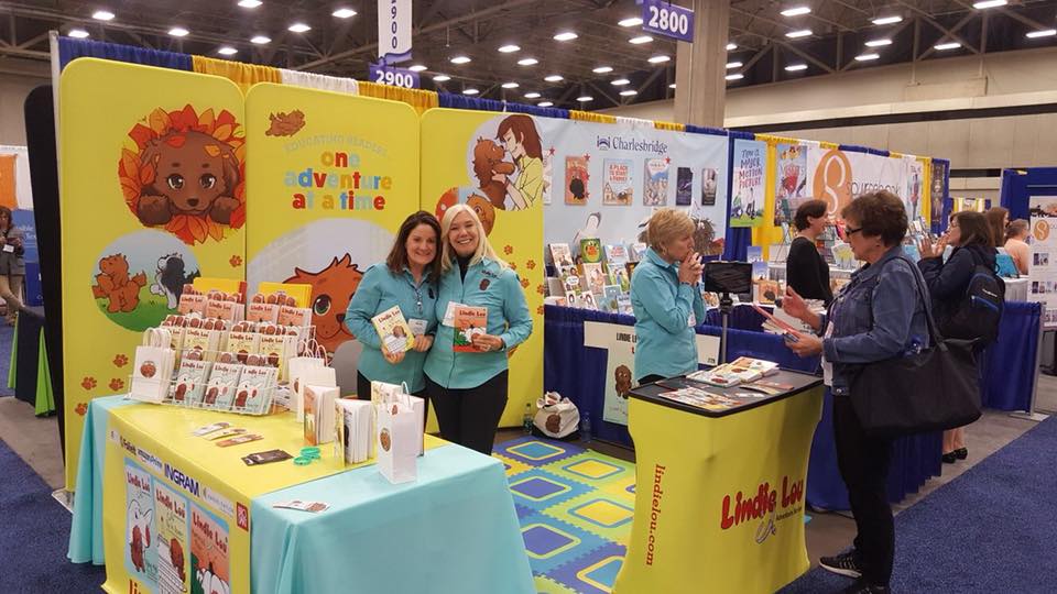 Booth example has table for books and a small info counter for conversation, Lindie Lou Adventure Series, MODdisplays