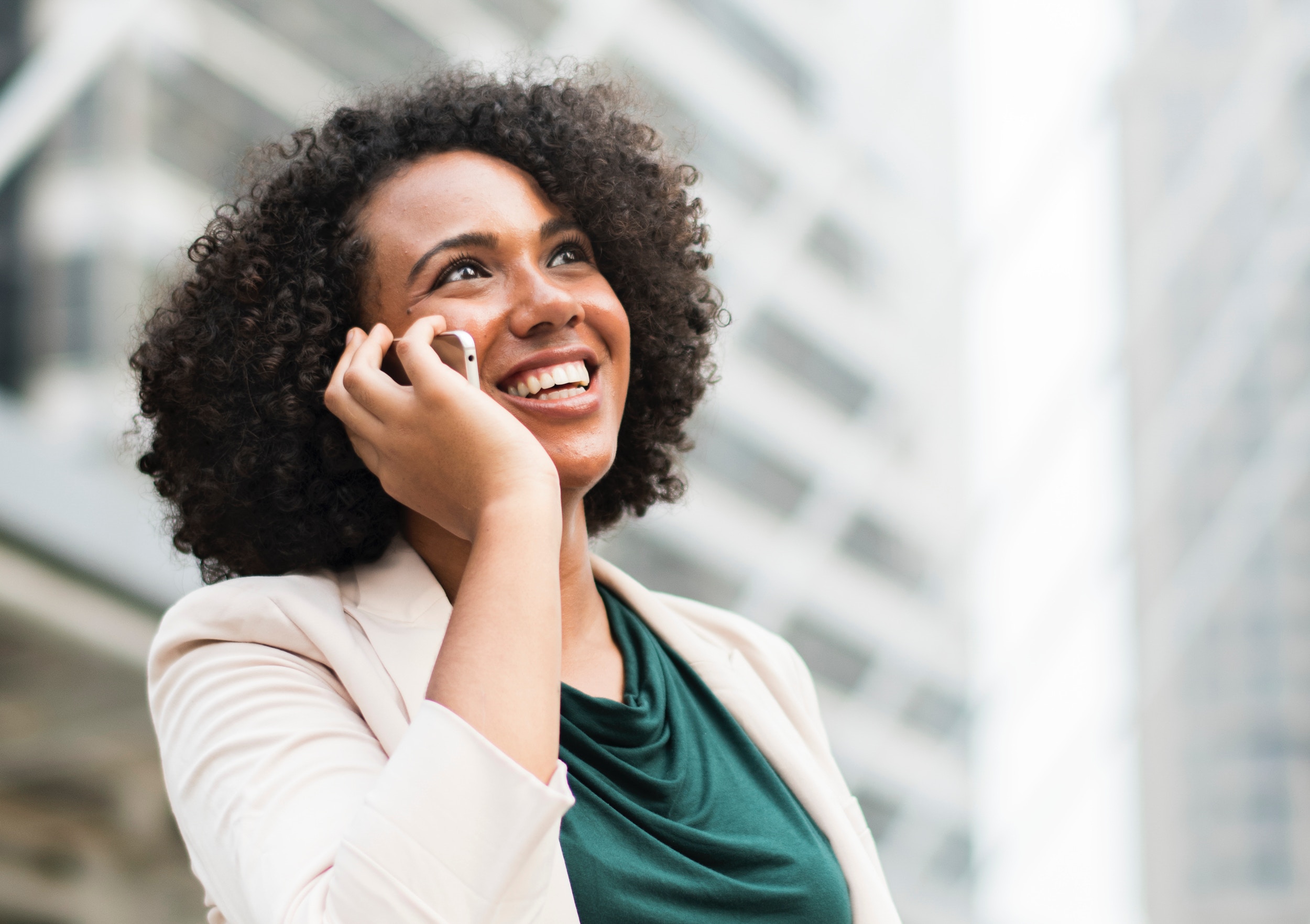 Trade show exhibitor talking and laughing on phone