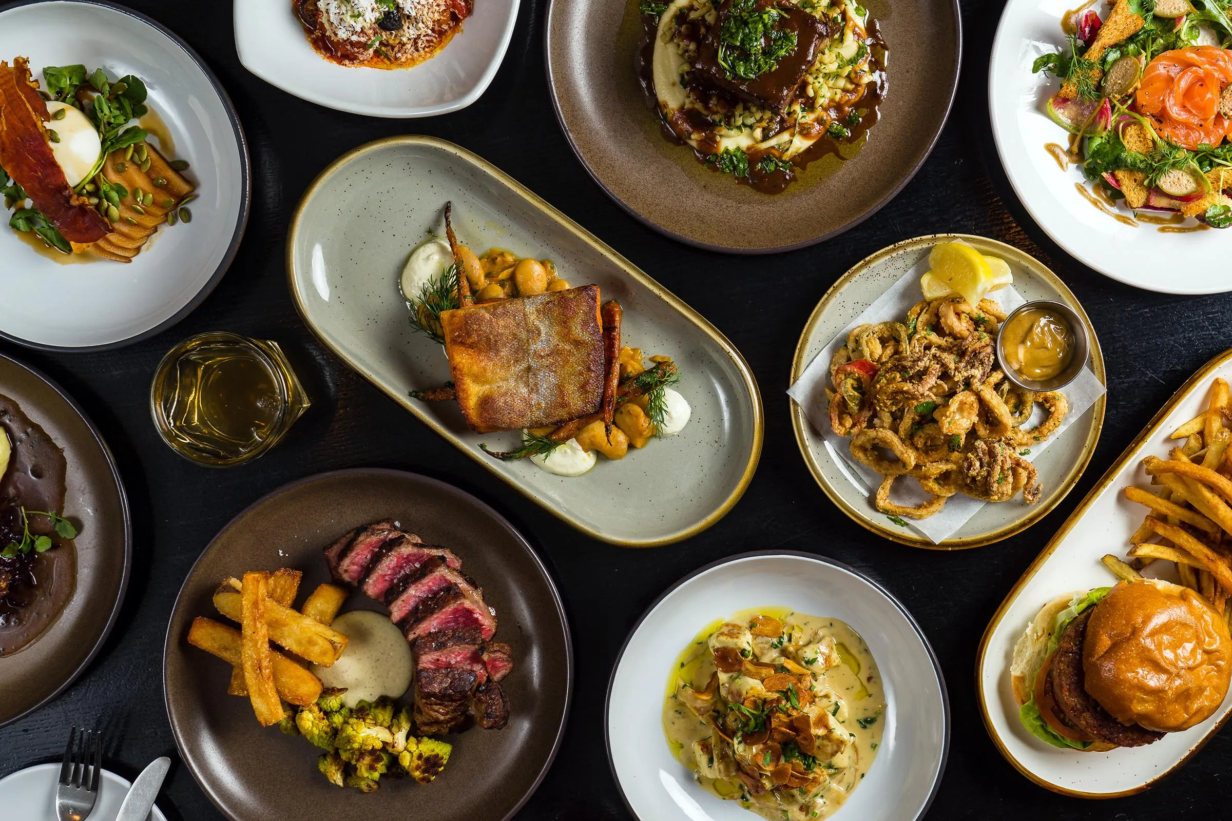 Essex diverse dinner menu with gluten-free calamari, NY Strip Steak, Seared Salmon and homemade gnocchi