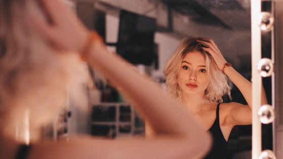 Self-Care: Woman looking into mirror