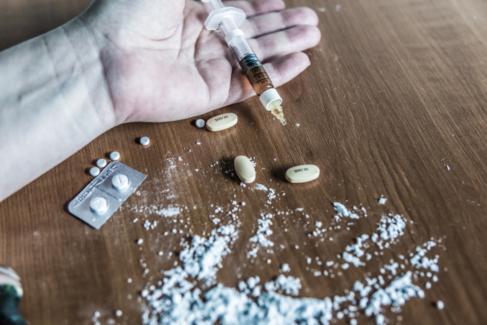 Fentanyl on table next to hand