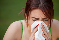 Woman suffering from chronic sinusitis symptoms.
