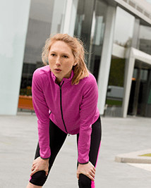 Woman suffering from lack of breath after running