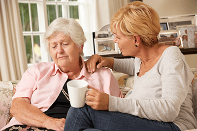 Daughter struggling to converse with Mother who can't hear