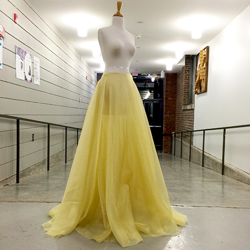 Long golden skirt on a mannequin.
