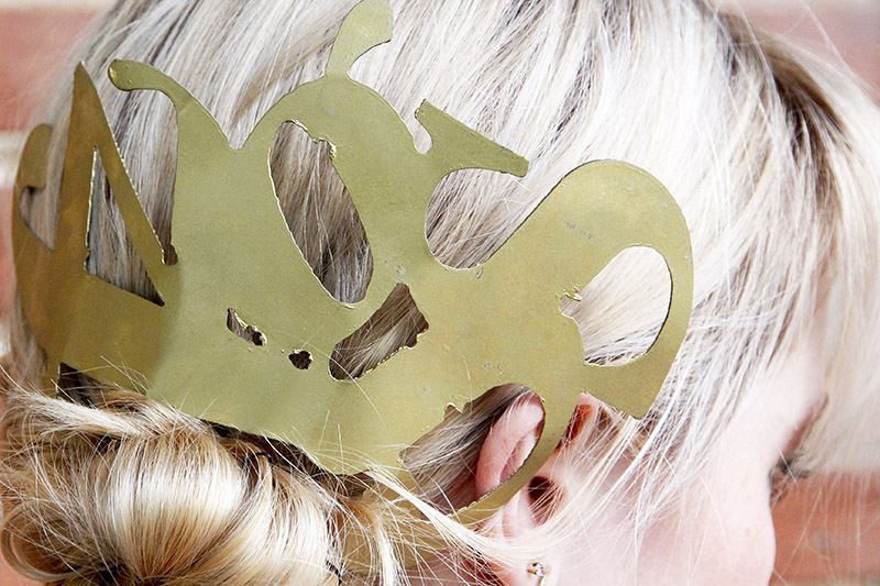 Metal typography in blonde hair.