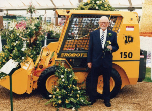 Planting flowers with a JCB