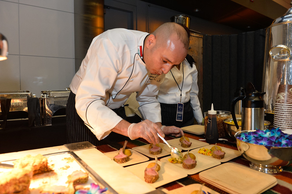 Chef Djamel Amroune, Embassy of Iraq, plates kibbeh over crusted lamb chop with cilantro mechouia lamb jous