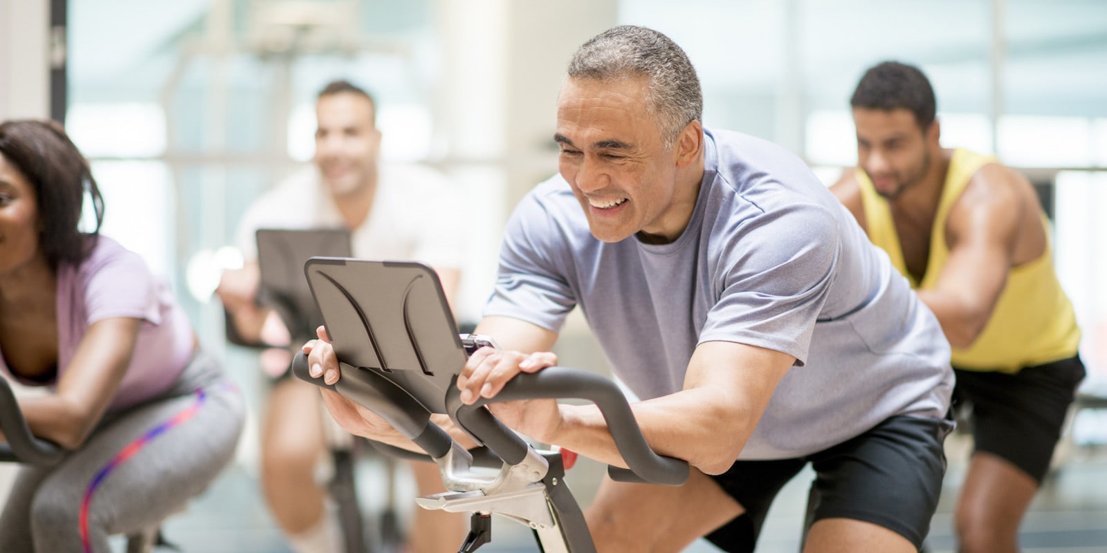 Company CEO riding treadmill with staff