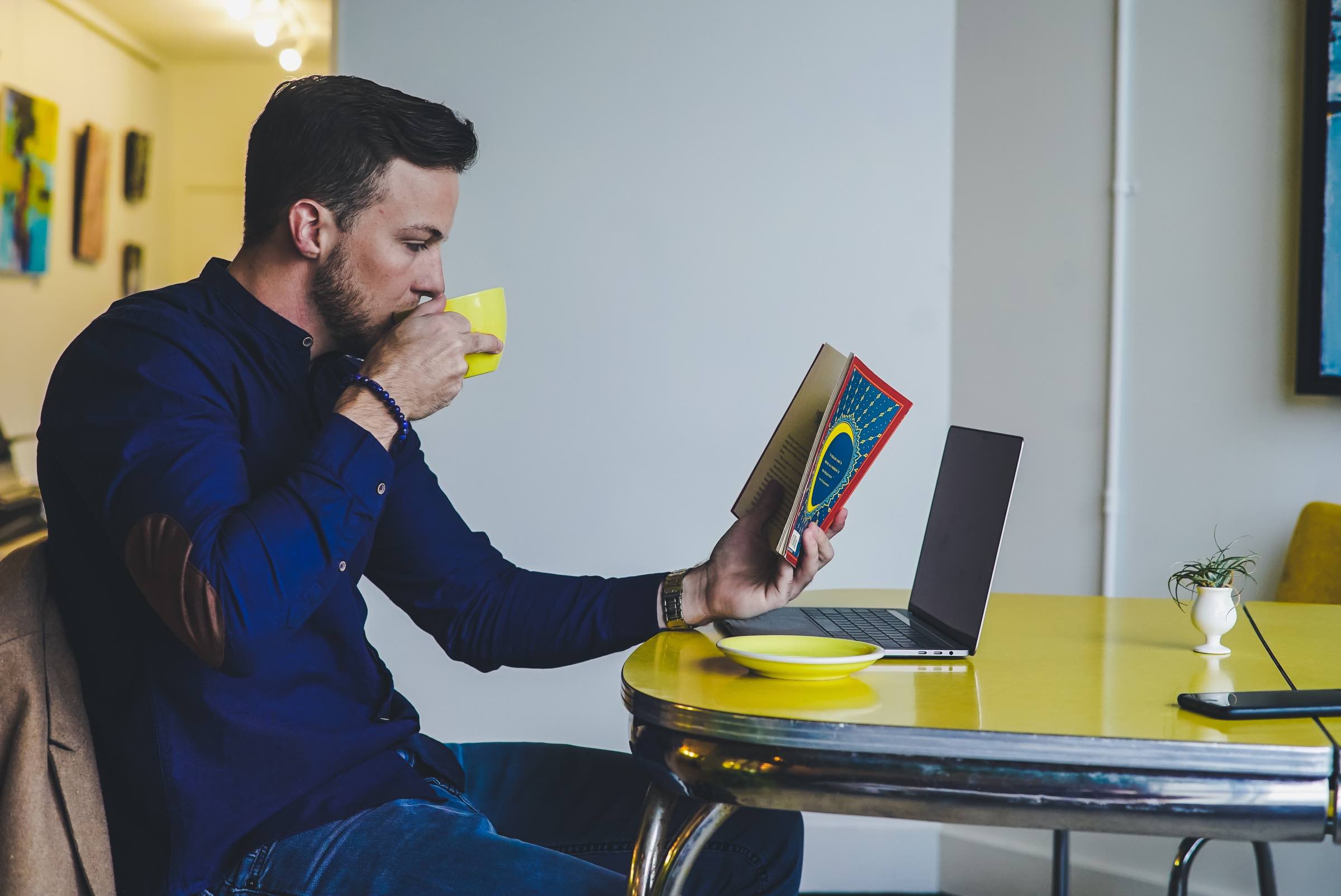 zestful blog image of happy male employee drinking coffee reading magazine