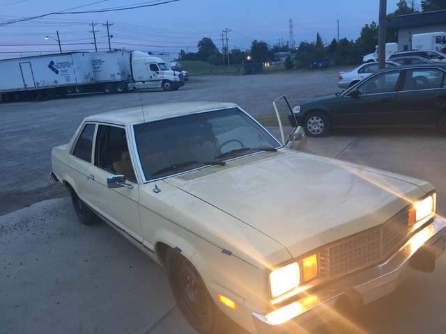 front view of eric the car guy's turbo fairmont with its headlights on