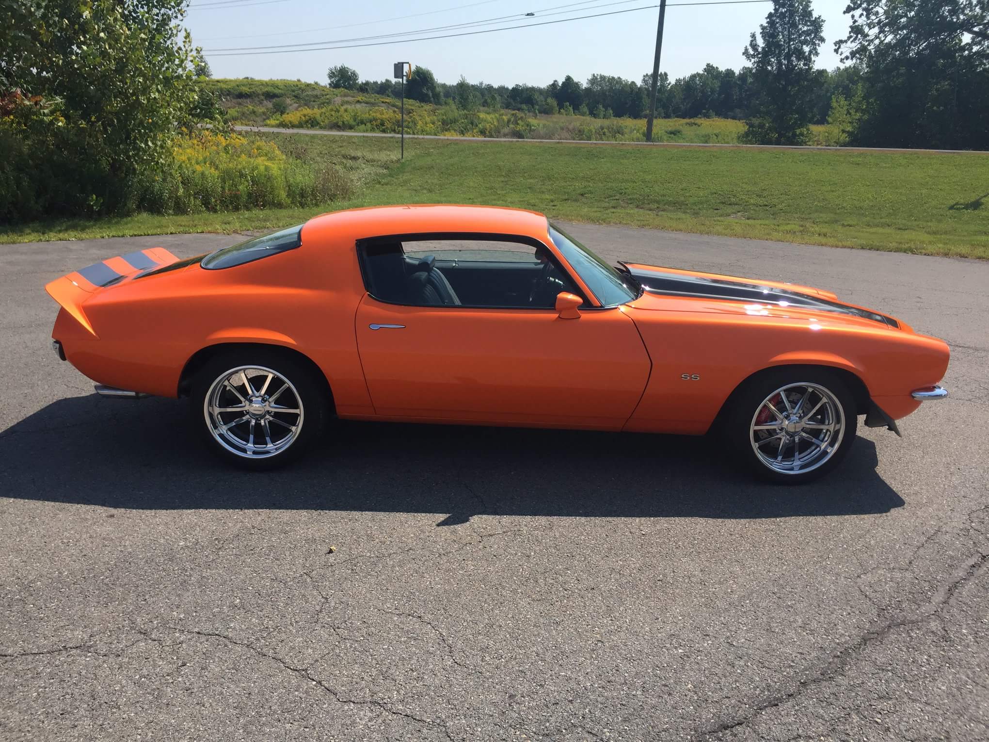 side view of orange 1970 camaro rs/ss