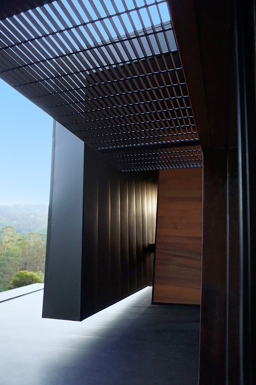 Designed for a tech entrepreneur couple and their young twins, the home in Mill Valley, California is a modern composition in articulated form. Located on a large wooded canyon site and sharing the land with a family of nesting red-tail hawks, this residence is designed to integrate into the landscape through cascading forms and natural materials. The exterior is a montage of natural wood, oxidized steel, and rich zinc panels blending with the surrounding foliage with many of these materials utilized on the interiors as well blurring the lines between inside and out. The main feature of the house is an observatory for the nesting raptors in the tree above visible through the upper level roofs to connect the interior to the beautiful natural surroundings.