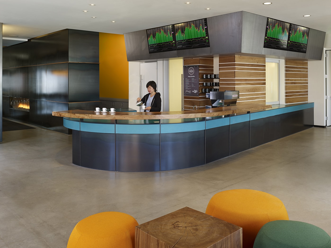 QA was commissioned to design the new corporate headquarters for New Relic, the fast-growing industry leader in Data Analytics for App Monitoring. Custom pen Collaborative Areas are located in the floor’s corners for quick informal meetings and impromptu mini-workstations for staff visiting other departments. The most dynamic space within the four full floors of offices is the large Café and All Hands Area that accommodates informal meetings, all-office presentations, and interactive interoffice social functions. The palette for New Relic was derived from the image invoked by its name- the juxtaposition of old and new, modern and decayed. Using reclaimed old growth elm, the wood is mingled amongst flamed steel walls, perforated metal panels and colorful furniture to create a warm, lively, and inviting work place. We are honored and excited that our design for the New Relic Headquarters was selected by the SF Business Times as one of the top "10 Coolest Offices in the Bay Area 2018."