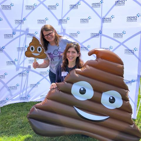 two girls smiling with poop emoji - AnimalBiome