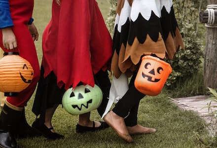 Trick-or-treaters walking on Halloween