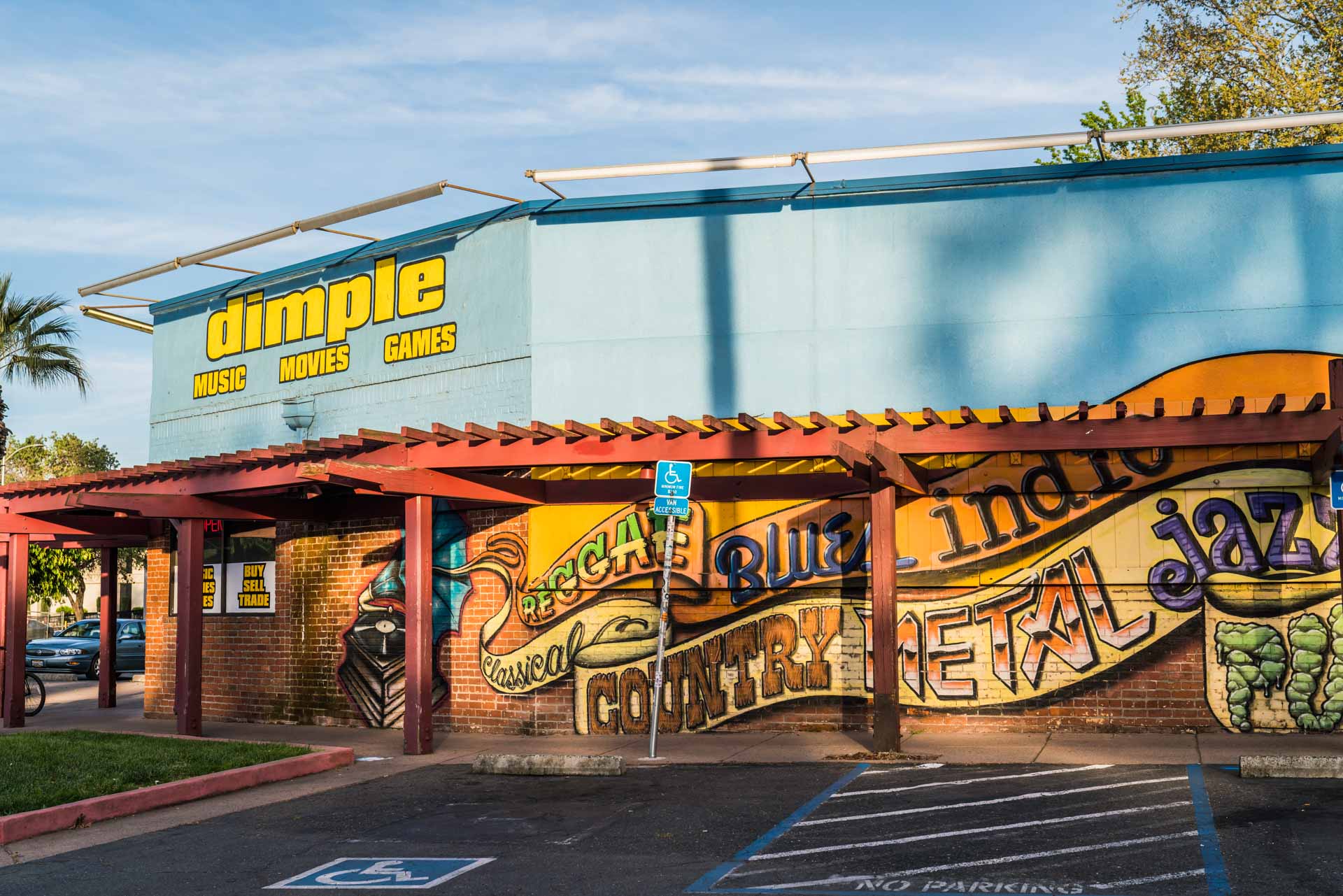 A mural outside of Dimple Records on Broadway in Curtis Park for Visit Sacramento.