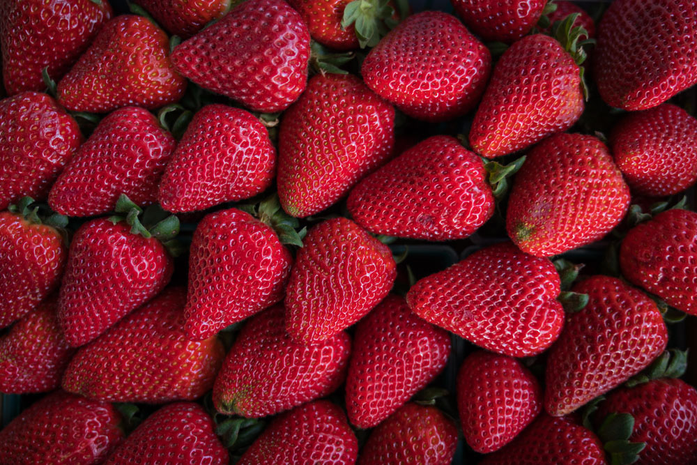 Strawberries at the Midtown Farmer's Market in Midown, Sacramento for Visit Sacramento.