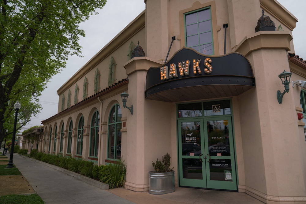 The outside of Hawks Provisions and Public House, a Farm to Fork restaurant in East Sacramento, for Visit Sacramento.