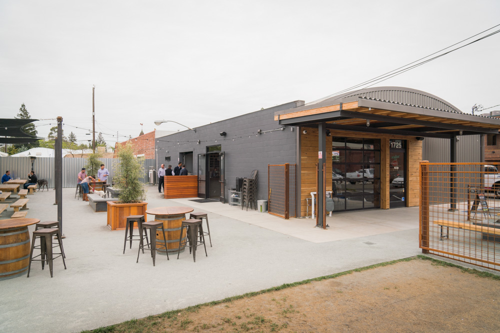 The patio at the SacYard Tap House where people drink beers, for Visit Sacramento.
