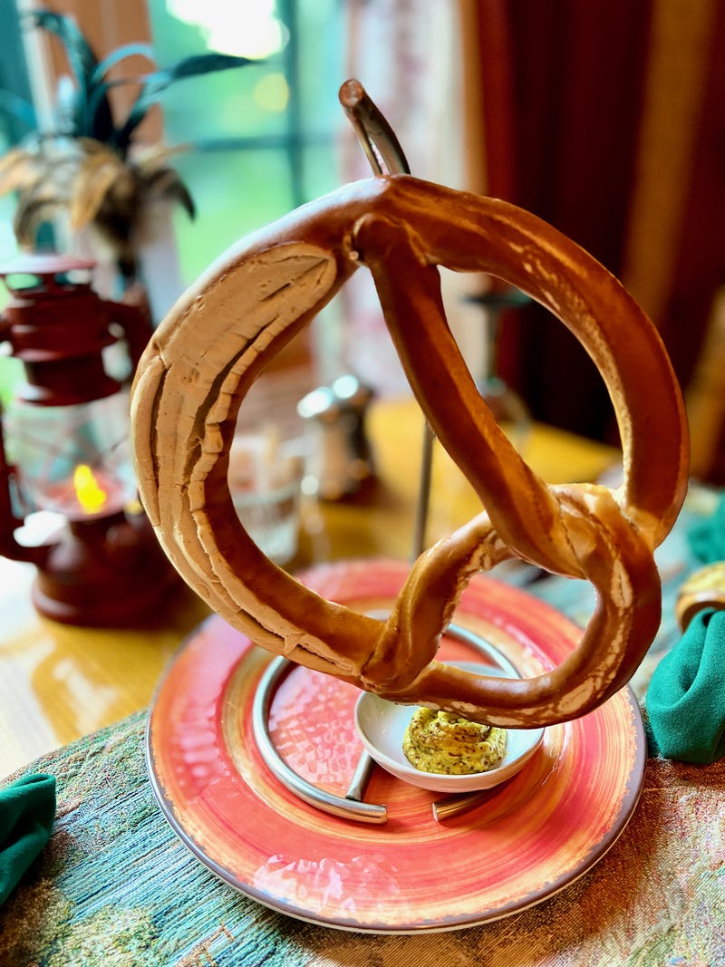 An oversized soft-baked pretzel with famous Adirondack Alps Mustard at the Lake Clear Lodge & Retreat.