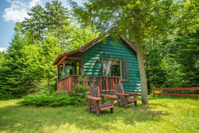 Guides Cabin in Summer with Adirondack Chairs