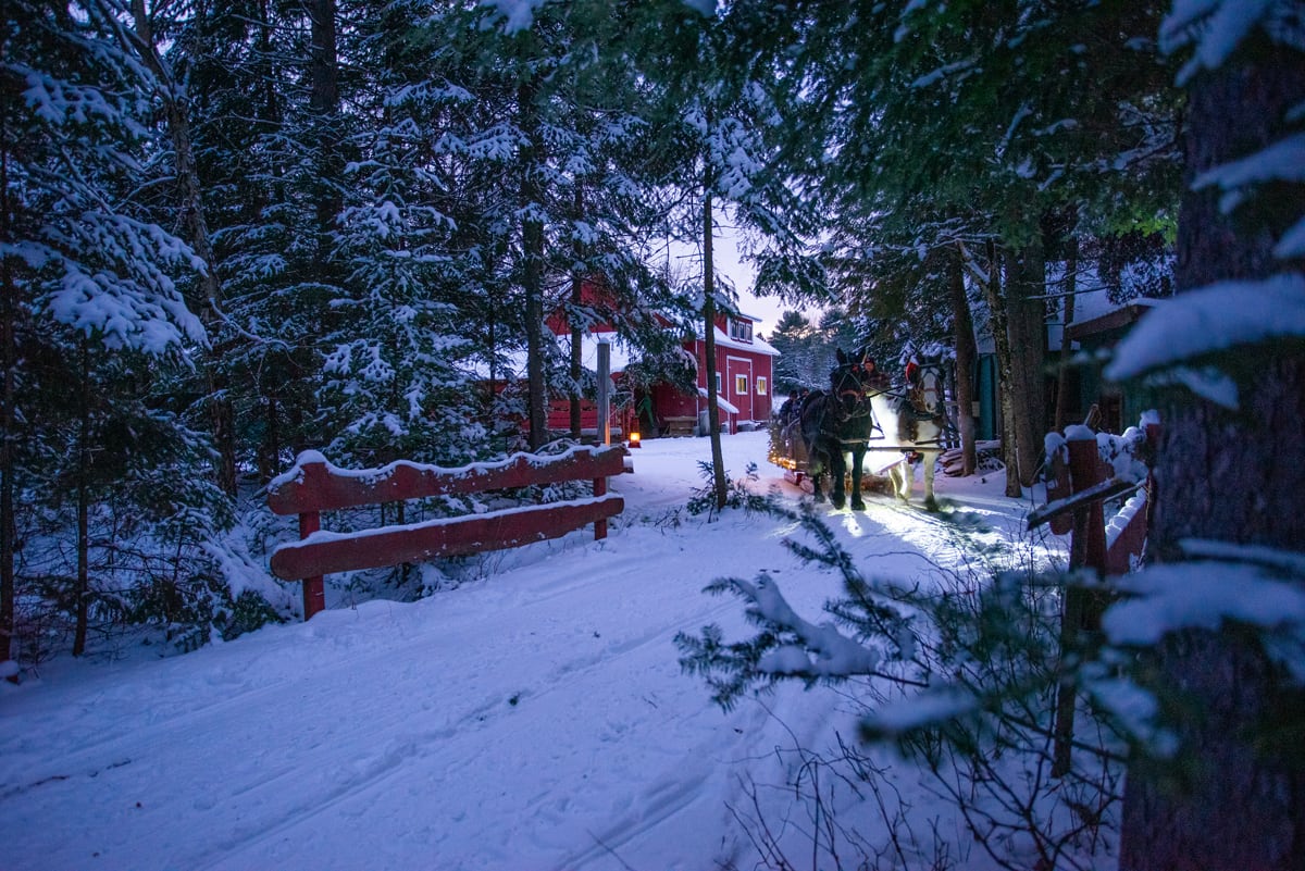 Horse-drawn Lantern-lit Sleigh Rides in the Adirondacks at the Lake Clear Lodge