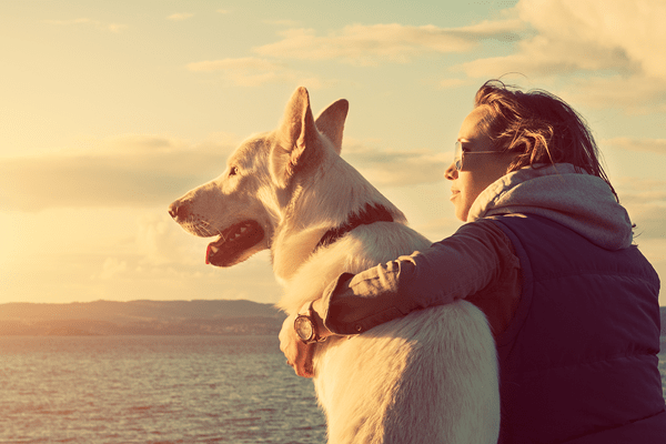 Relaxing on a vacation with a furry friend.